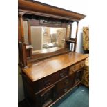 A late 19thC oak Art Nouveau mirror back sideboard, with canopy top inset with a copper panel, above