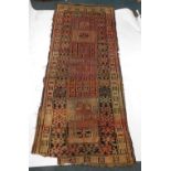 A Persian runner, with a geometric design, in red, orange, black, etc., 287cm x 122cm. (AF)