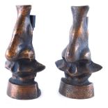 A pair of Dali style bronze menu holders, each of shaped form, unsigned, 13cm high. (2)