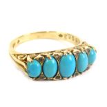 A 9ct gold dress ring, set with five graduated turquoise, size P, 3.7g all in.