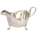 A George VI silver sauce boat, by Walker and Hall, of cape form on stepped feet with angular handle,