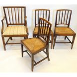 A set of four 19thC oak dining chairs, each with a rail back and a drop in seat, the armchair with a