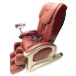 An electric massage chair, for back, seat and legs, with remotes.