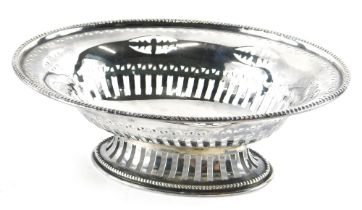 An Edwardian silver basket, by Steinhart & Co, of oval form, partially pierced on oval foot, Birming