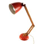 A vintage Anglepoise lamp, with wooden stem, metal orange cone shade and circular foot, 45cm high.