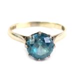 A 9ct white gold dress ring, claw set with blue zircon, size O, 2.6g all in.