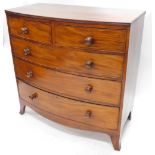 A Victorian mahogany bowfronted chest of drawers, the top with a reeded edge above two short and thr