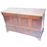 A early 19thC Lancashire oak and mahogany crossbanded mule chest, the hinged top enclosing a vacant