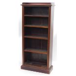 A mahogany open bookcase, with a raised gallery above four adjustable shelves, on a plinth, 159cm hi