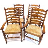 Two pairs of Brights of Nettlebed oak ladder back chairs, each with a rush seat, on turned legs with