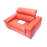 A red leather and chrome armchair or bed, with metal frame work.