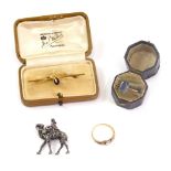 Various jewellery, a camel brooch, 3cm high, further bar brooch set with red stone and two dress rin