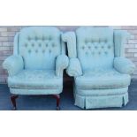 Two similar armchairs, each upholstered in green and pale blue fabric, one with cabriole legs.