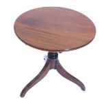 A mahogany occasional table, with a circular top on a turned column and reeded tripod base, 53cm hig