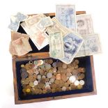 Various world coins and banknotes, some GB, William IV and later, contained in a heavily carved box,