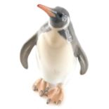 A Royal Copenhagen figure of a standing penguin, number 417, printed marks to the back, 25cm high.