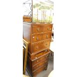 A painted tile top table, and a pair of mahogany three drawer chests.