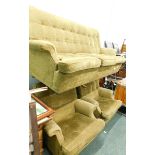 A Retro three piece suite, upholstered in buttoned green fabric, the sofa 190cm wide. The upholstery