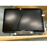 A Philips 22 inch television/DVD player in black, with wire and remote control.