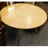 A modern circular cafe table, with chrome plated legs, 73cm high, 81cm diameter