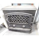 A cast metal electric heater, modelled in the form of a wood burning stove, 62cm wide.