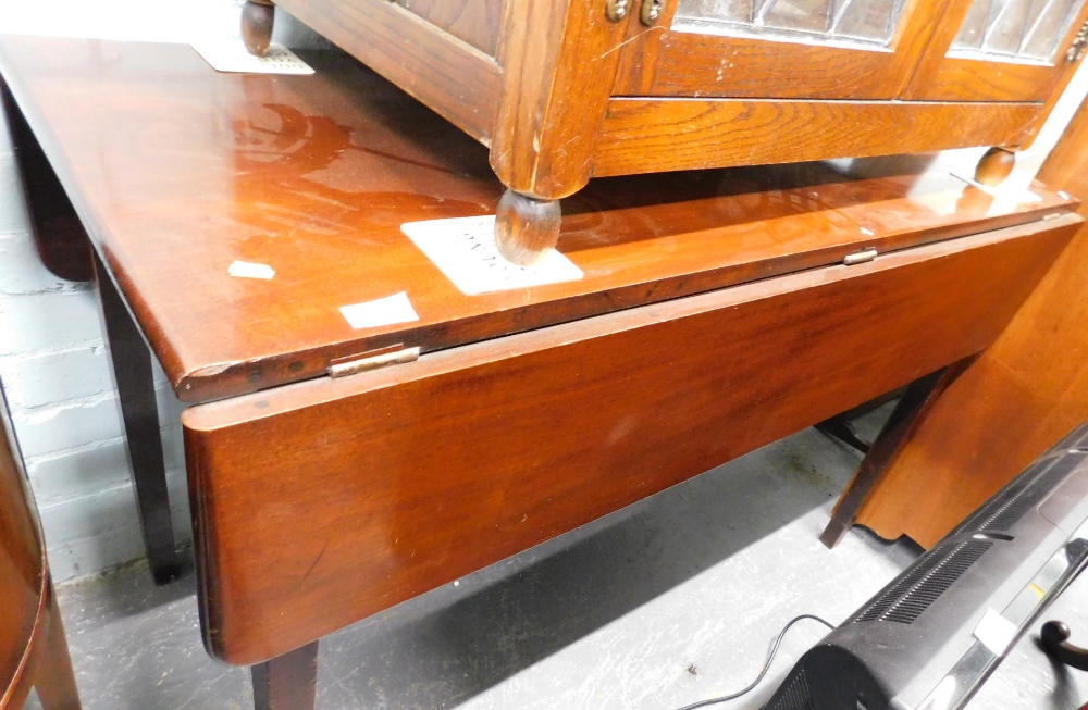 A mahogany drop leaf table, on square tapering legs, 119cm wide.