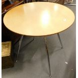 A modern circular cafe table, with chrome plated legs, 73cm high, 81cm diameter