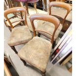 A set of three Victorian mahogany dining chairs, each with a padded seat on reeded turned tapering l