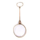 A 20thC lorgnette, with compressed ring handle, turned stem, orb section and circular glass.