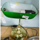A club style desk lamp, with green shade on brass stand.