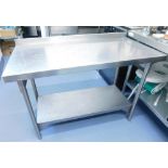 A Vogue stainless steel catering table, of rectangular form with undertier on cylindrical legs, 81cm