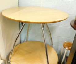 A modern circular cafe table, with chrome plated legs, 73cm high, 81cm diameter