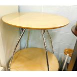 A modern circular cafe table, with chrome plated legs, 73cm high, 81cm diameter