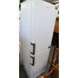 A Grundig fridge freezer, in white.