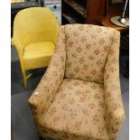 An oak bookcase with two glazed doors, Lloyd Loom type yellow painted chair, and an armchair.