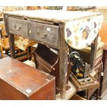 A 19thC stained pine drop leaf kitchen table, set with two drawers.