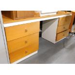 A light oak pedestal desk.