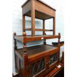 An Old Charm oak side cabinet, the top with a raised gallery and turned spindles, on turned supports