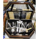 A part canteen of silver plated cutlery in oak canteen.