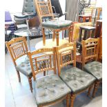 A set of five oak dining chairs, with spindle backs.