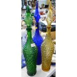 Three large pressed glass pharmaceutical style bottles with elaborate stoppers.