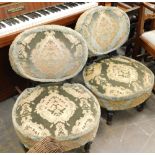 A pair of Victorian ebonised nursing chairs, each with a padded back and seat, on turned part fluted