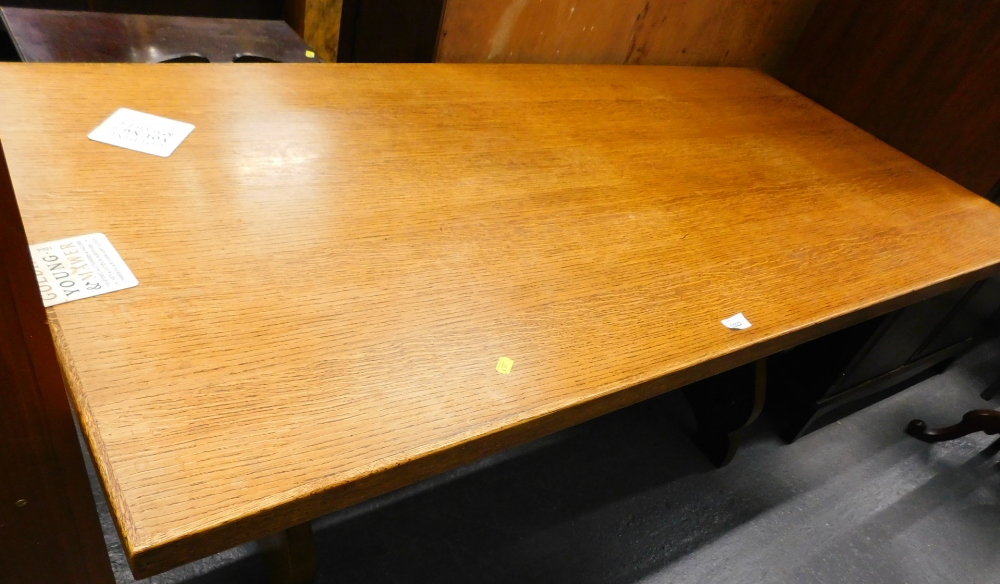 An oak refectory table, the rectangular top of trestle ends, 79cm x 158cm.