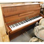 A mahogany upright piano by Moore & Moore, 131cm wide.