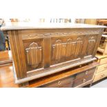 An oak coffer with linen fold panels to the front, 95cm wide.