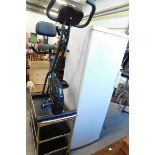 A Parker Knoll recliner chair, three tier tea trolley, Neostar exercise bike and Proline fridge free