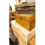 Two travel cases, tin trunk, and a pine chest of two short and three long drawers.