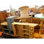 A teak office desk, set of index drawers, Lloyd Loom linen basket and matching stool, trolley, wall