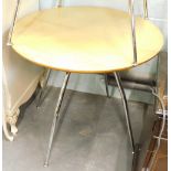 A modern circular cafe table, with chrome plated legs, 73cm high, 81cm diameter.