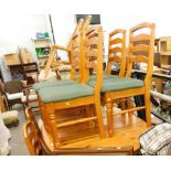 A pine D end dining table and six ladder back chairs with over stuffed seats, in green material an